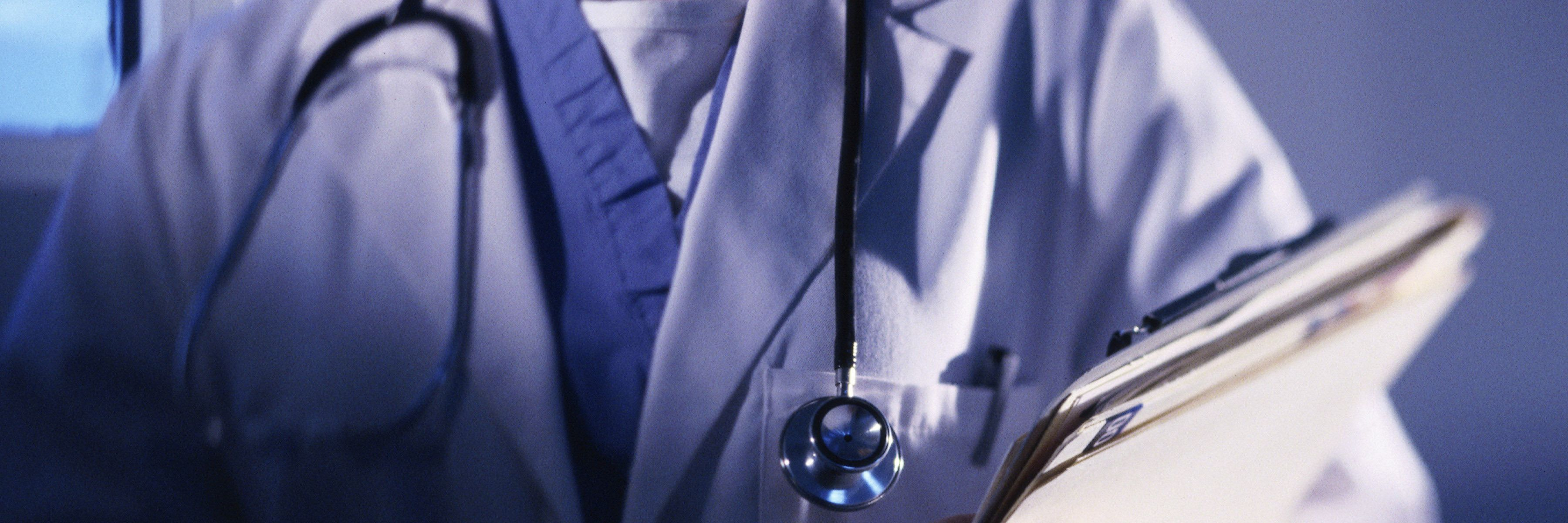 Doctors Not Treating You Because They Don't Understand Your Illness doctor holding medical files