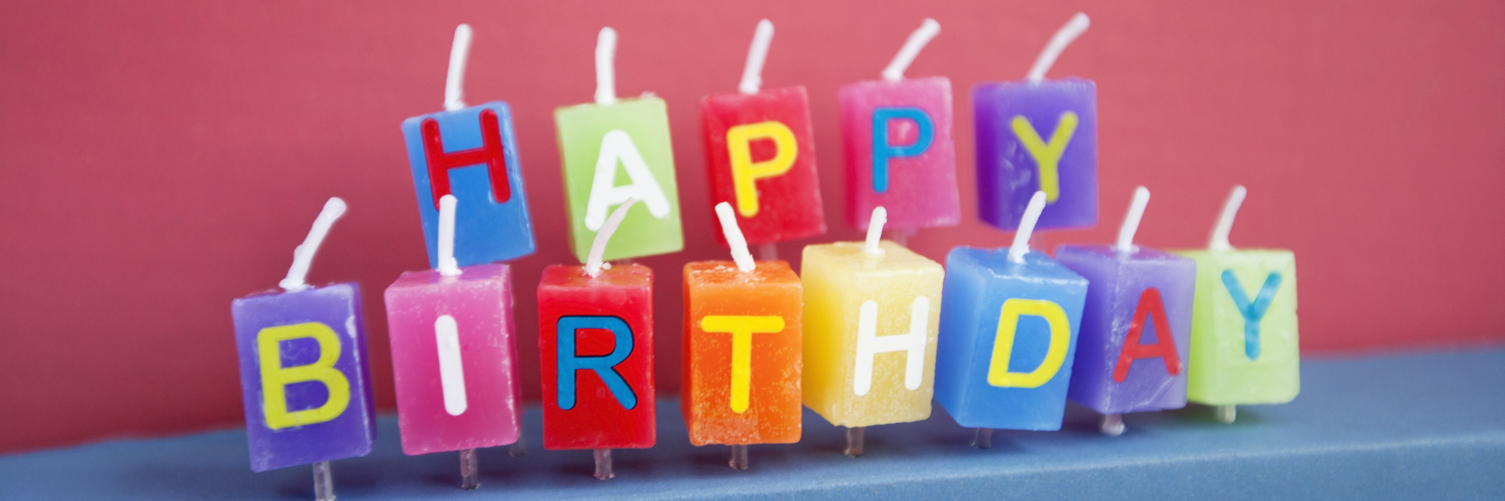 Why I Celebrate Two Birthdays as a Suicide Attempt Survivor Unlit birthday candles over colored background