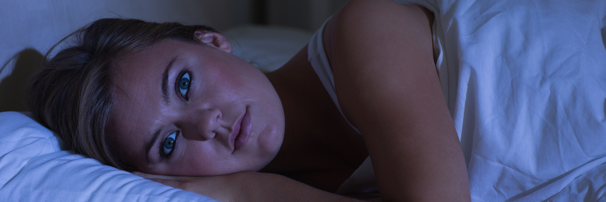 Being Unable to Sleep Because of Chronic Pain woman lying awake at night