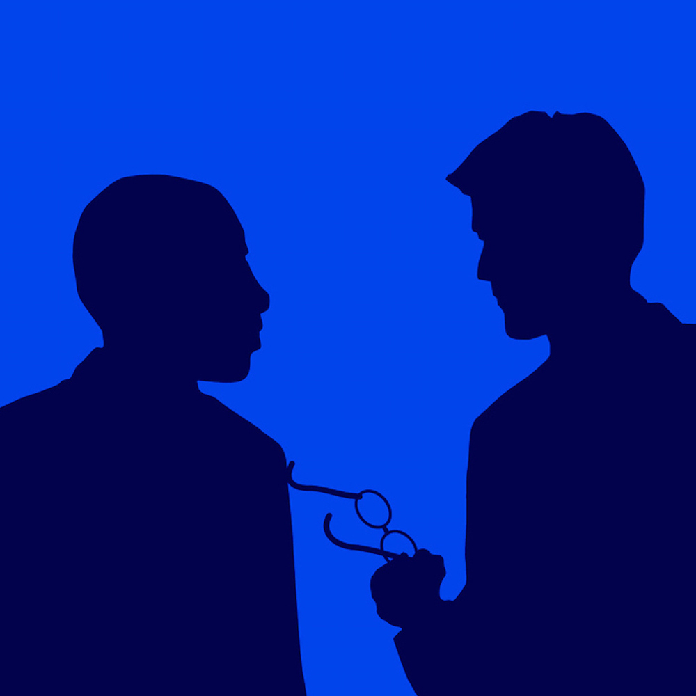 Silhouettes of two male figures talking, with one person holding a pair of glasses