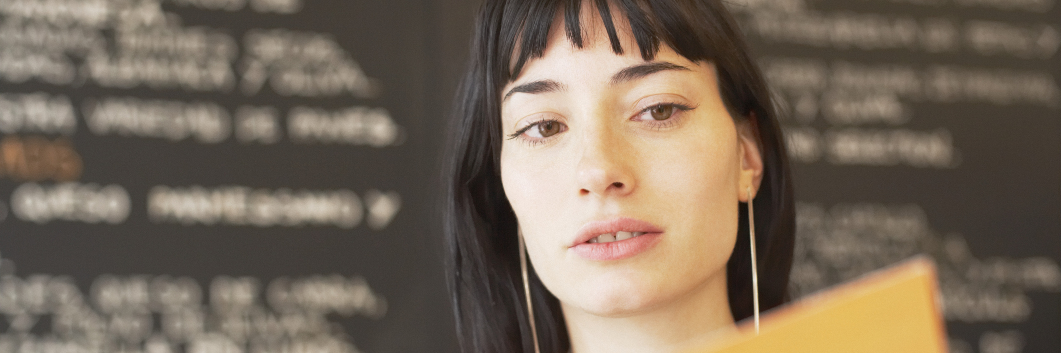 Tips for Eating Out When Restaurants Put the Calorie Count on Menus Portrait of a young woman holding a mobile phone