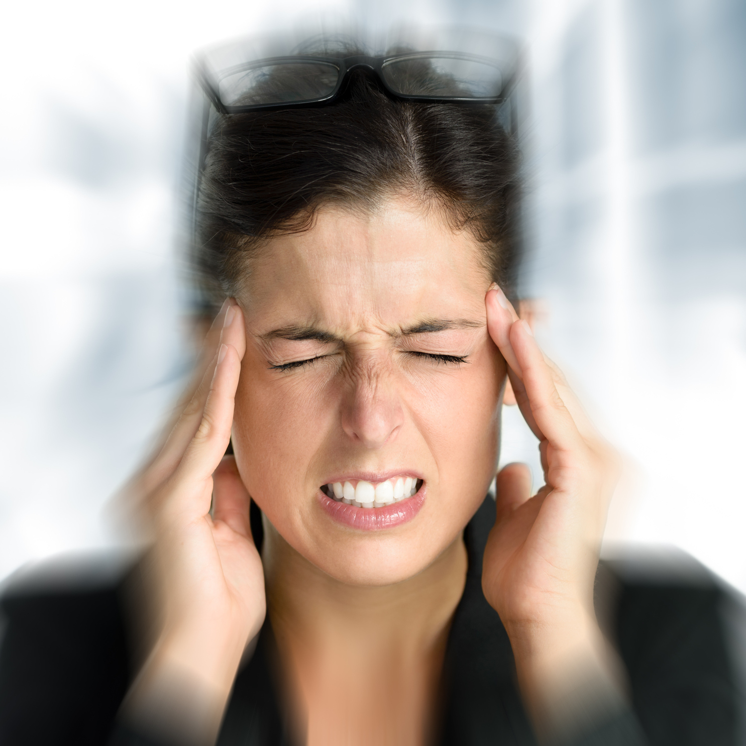 woman feeling dizzy and holding her head