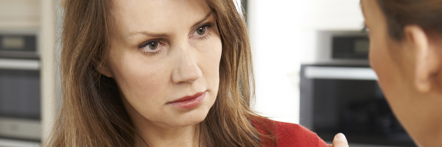 Why You Shouldn't Ask People If They Plan to Have Kids two women talking, one of whom looks upset