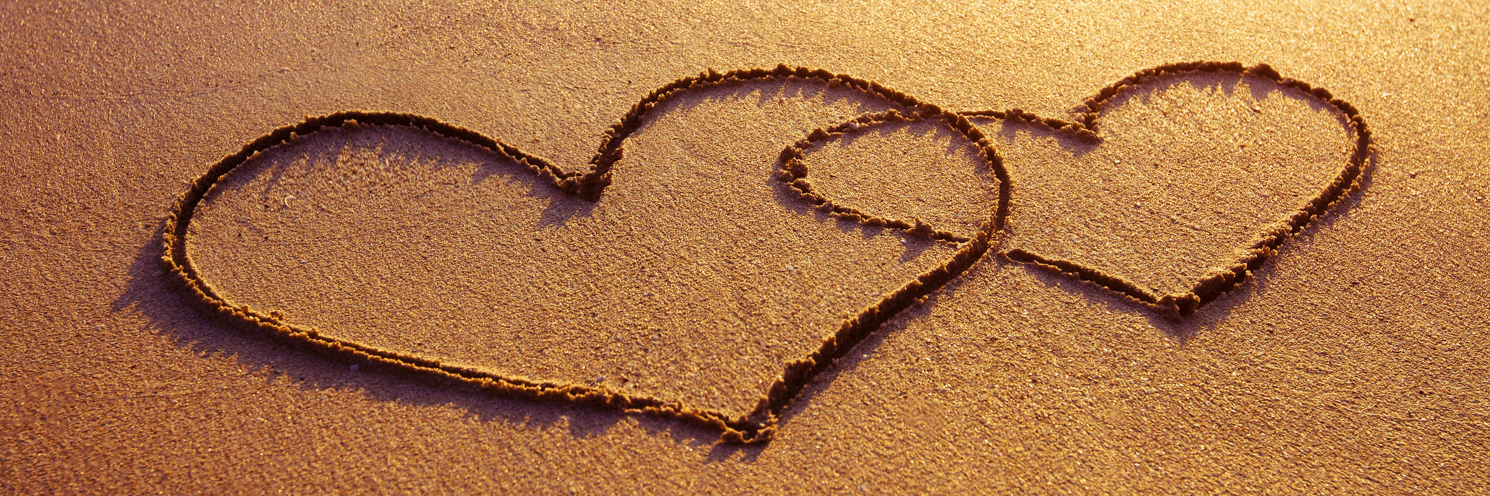 Finding Relationships With a Limb Difference Two hearts on sunset beach.