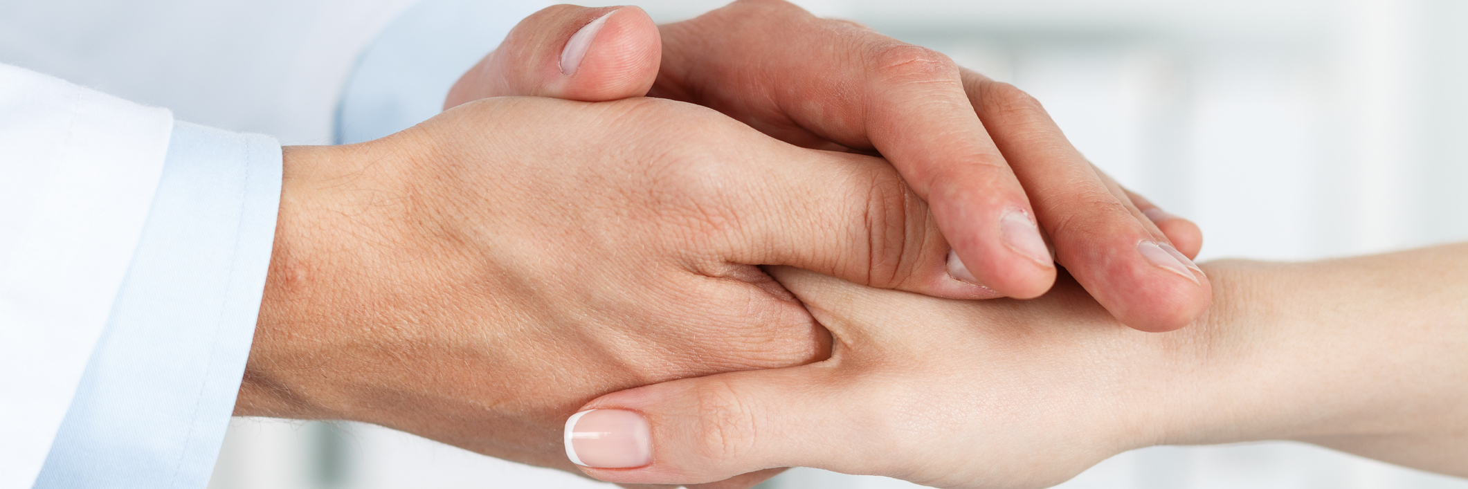 Why I No Longer Say, 'I Hate Doctors' Friendly doctor holding a patient's hand.