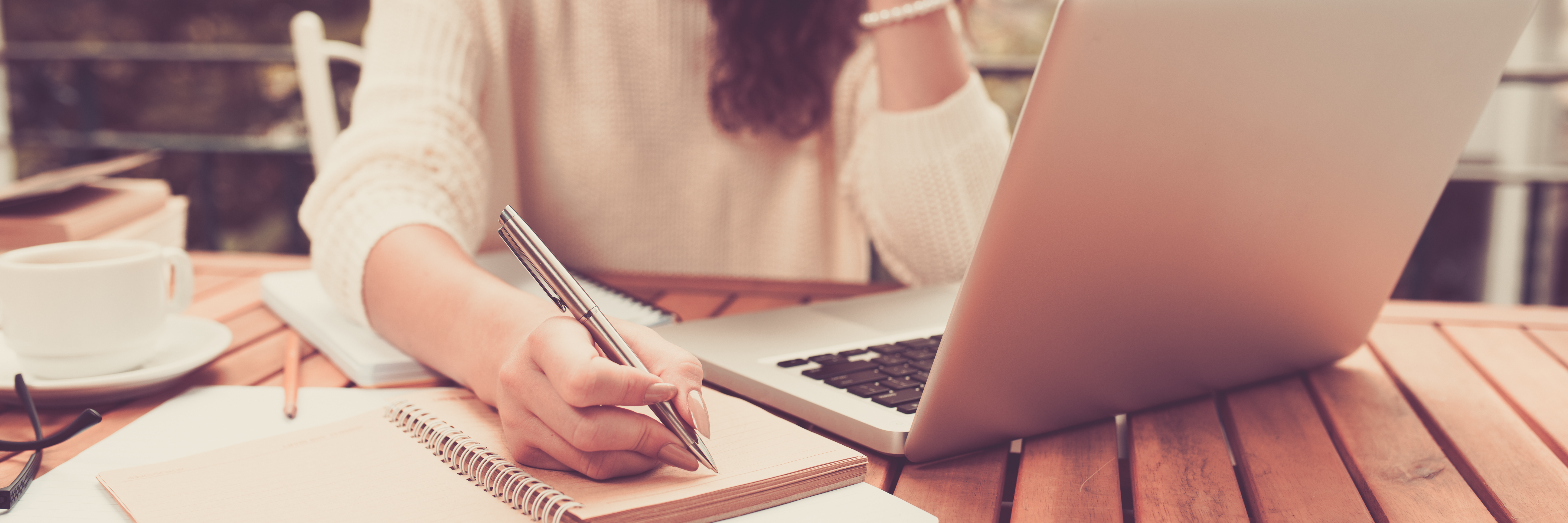 How I Learned to Deal With Rejection With BPD woman working on computer with notepad and pen in hand