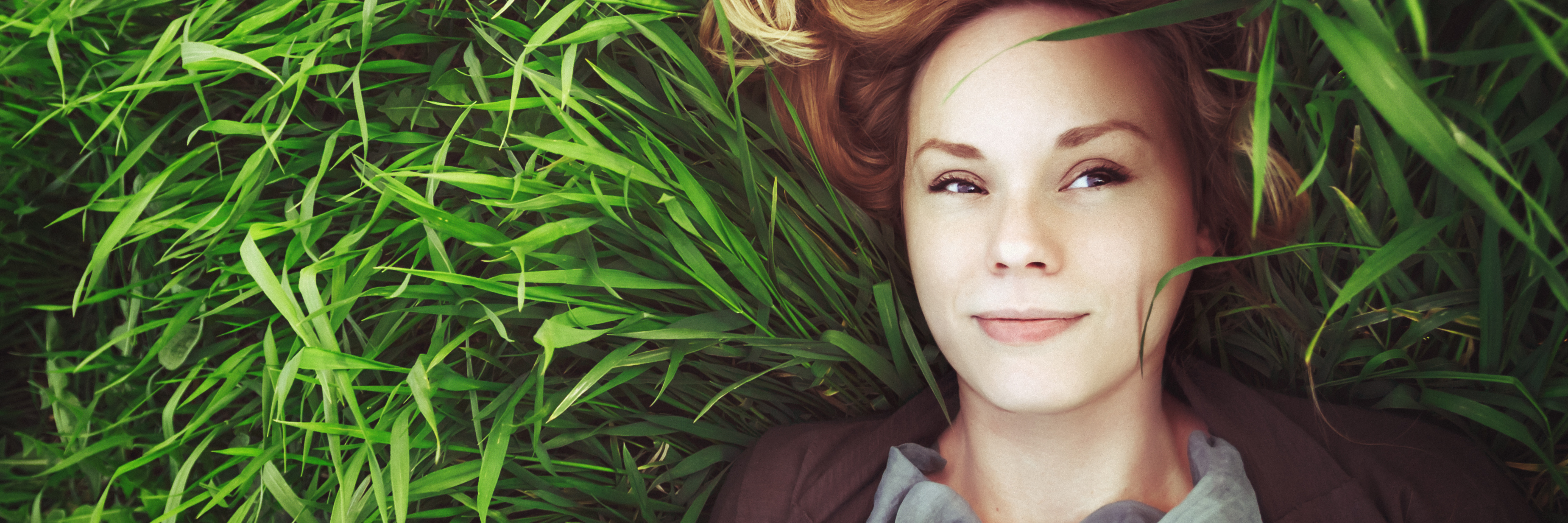 Ways to Help Build Self-Respect When You Have a Mental Illness young woman lying in summer grass