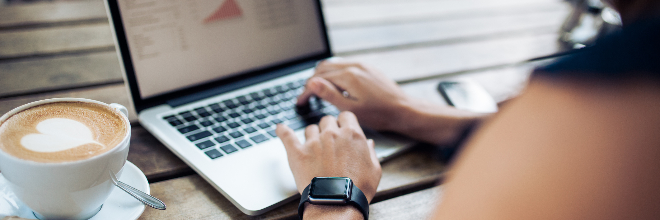 Chronic Illness: Unfriending Negative People on Social Media woman typing on laptop at a cafe