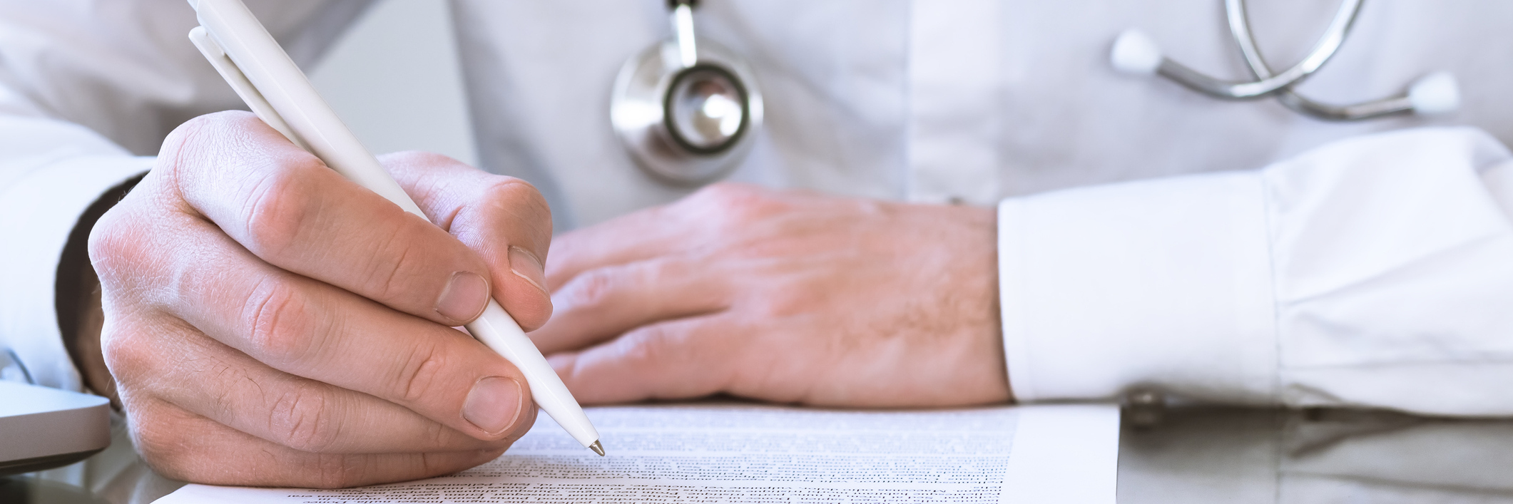 Dear Doctors, Please Complete My Disability Paperwork Doctor filling out paperwork.