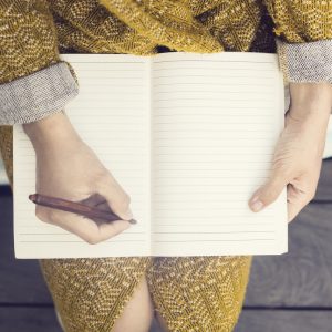 girl writing in her journal