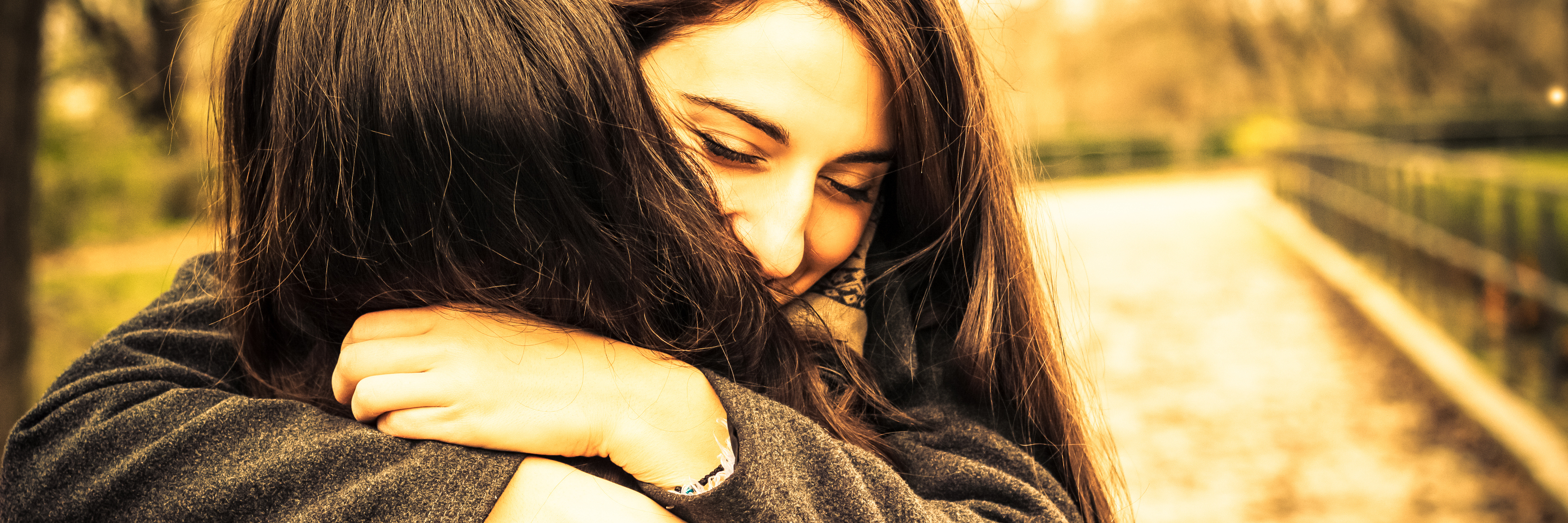What It Means When You Say You're There for Me two friends hugging in park