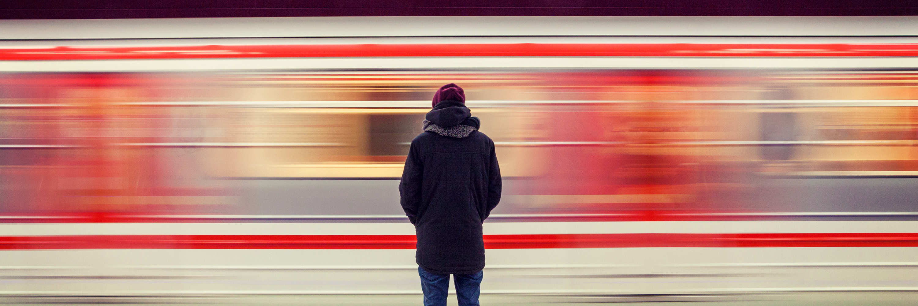 Illness: Feeling Left Behind, Like You're Not Accomplishing Anything person standing in front of a subway train that's moving