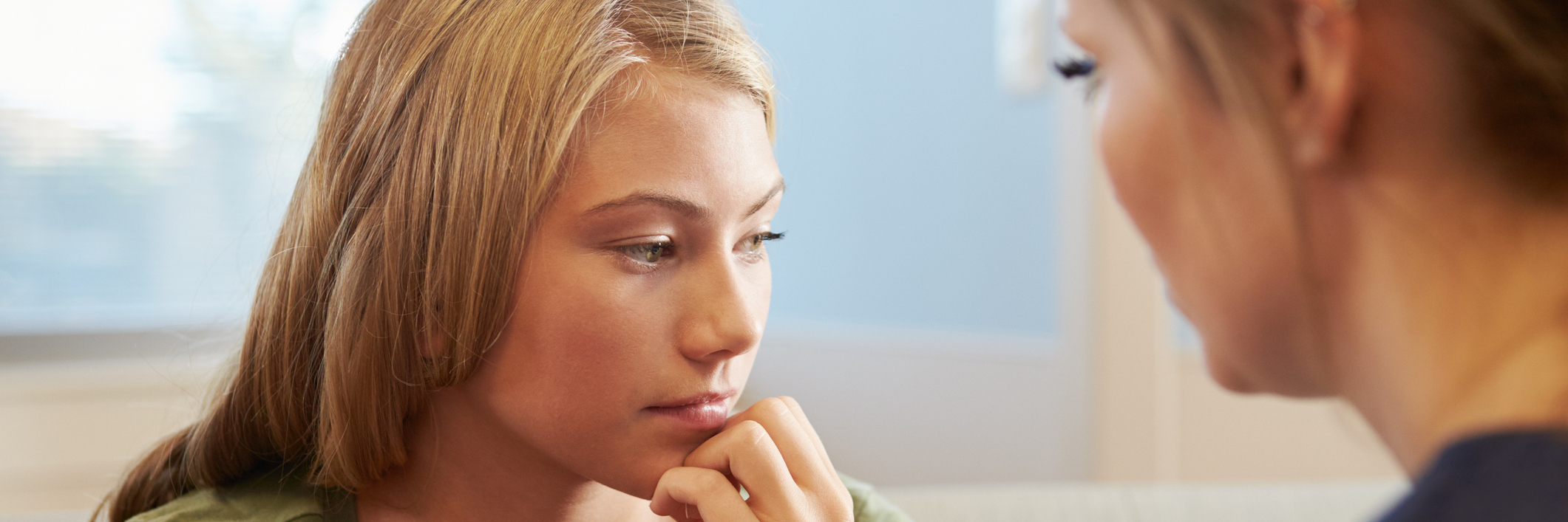 Fighting Mental Illness Stigma to Receive Therapy for Anxiety Disorder therapist talking to young woman