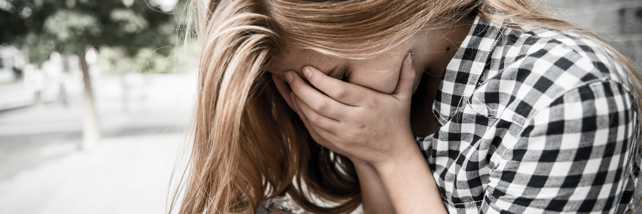 Why OCD Is Not a Quirky Personality Trait depressed blonde young woman sitting on steps with head in hands