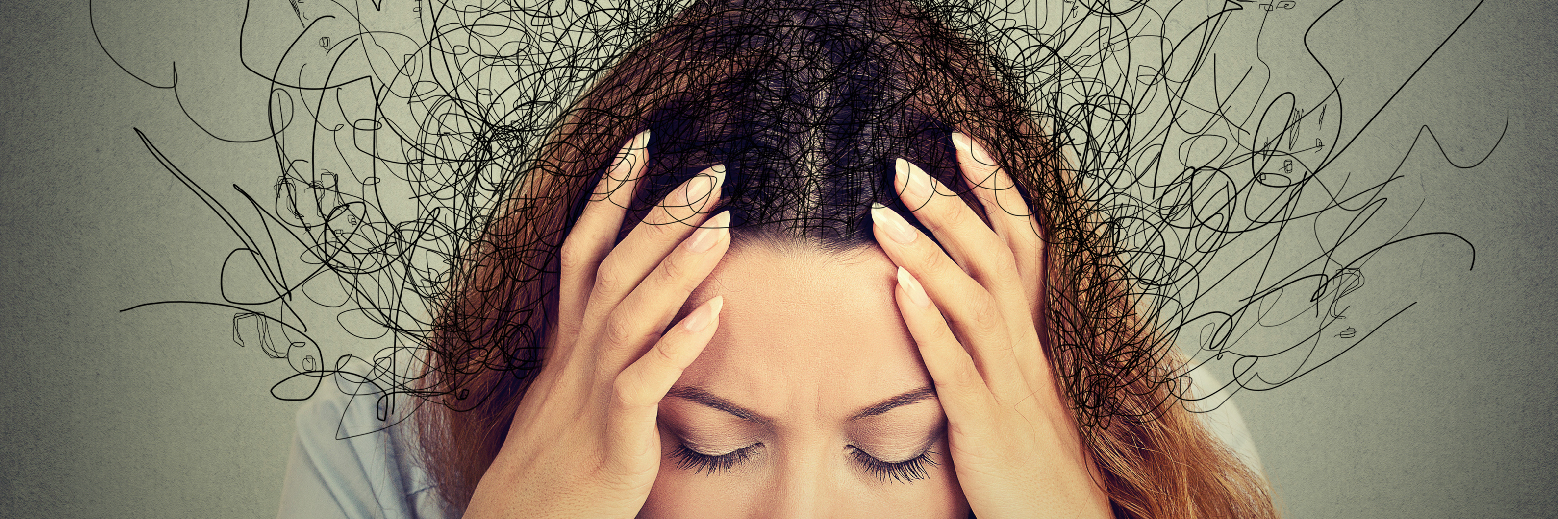 close up photo of woman with hands on head with lines coming from head in messy way