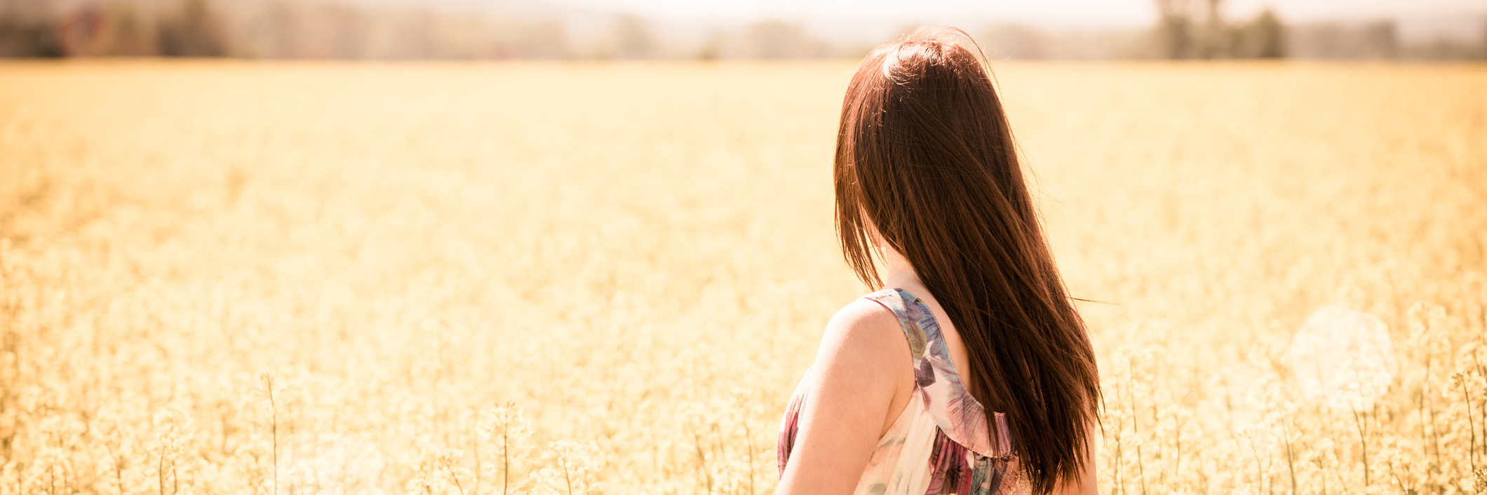 Respecting How Others Manage Their Chronic Illnesses woman walking through field of flowers
