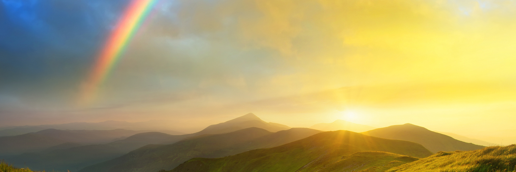 Learning Strength and Kindness From Being LGBTQ+ and Chronically Ill rainbow over mountains during sunrise