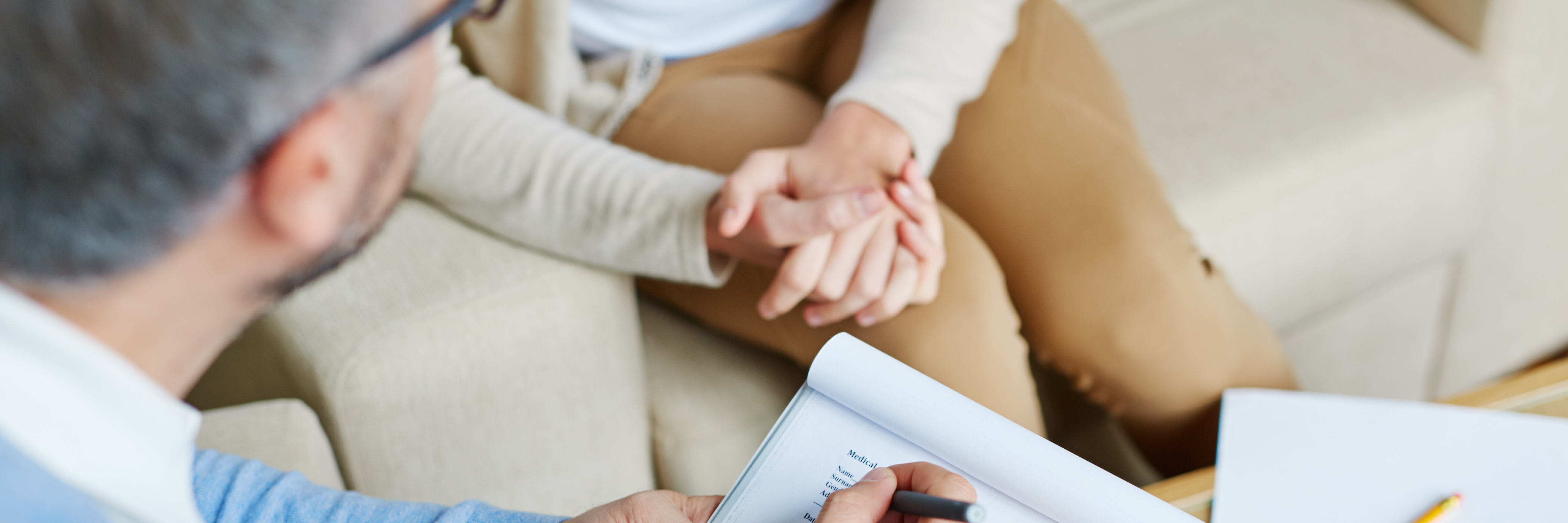 How to Get the Most From Therapy and Counseling male therapist with clipboard talking to female patient