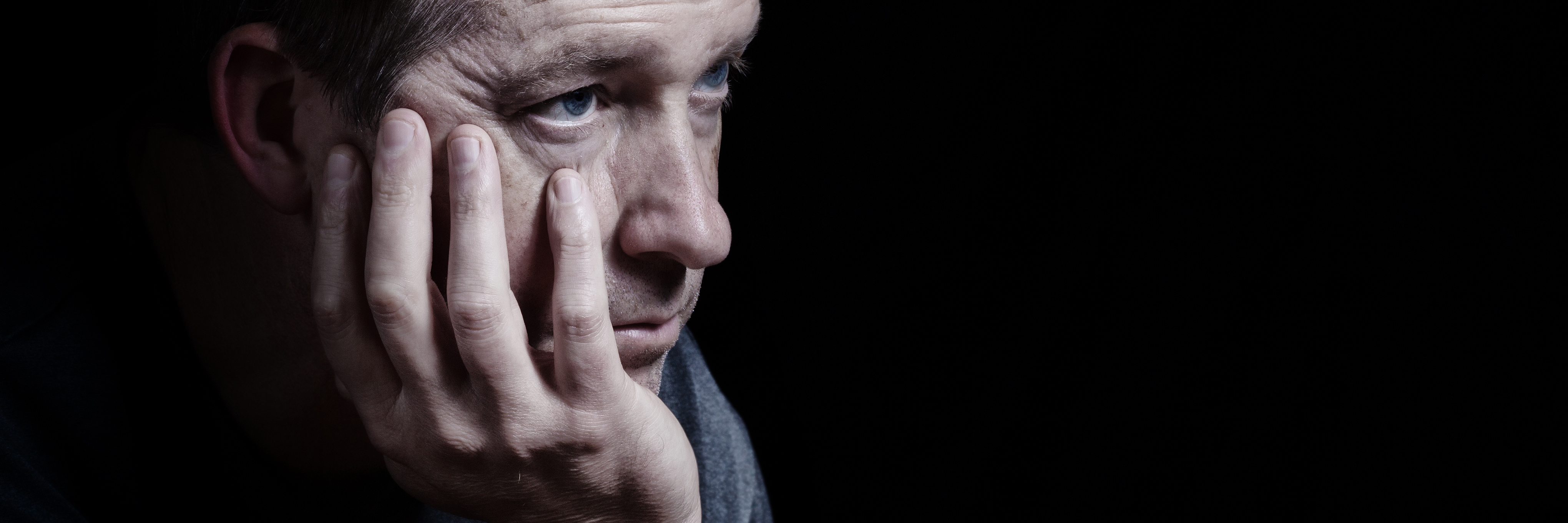 How I Spent 40 years With an Undiagnosed Mental Illness unhappy middle aged man depression against black background