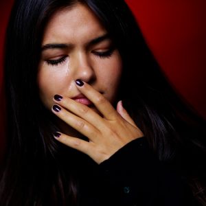Latina woman crying.