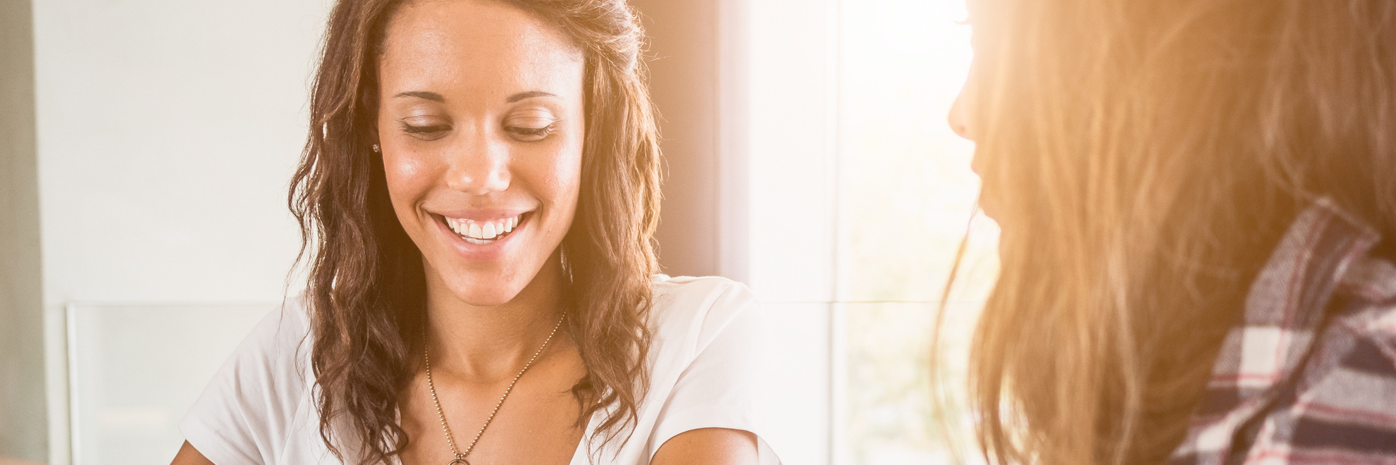 Lies to Stop Believing If You Have Social Anxiety Two friends at coffee shop, holding cups of coffee