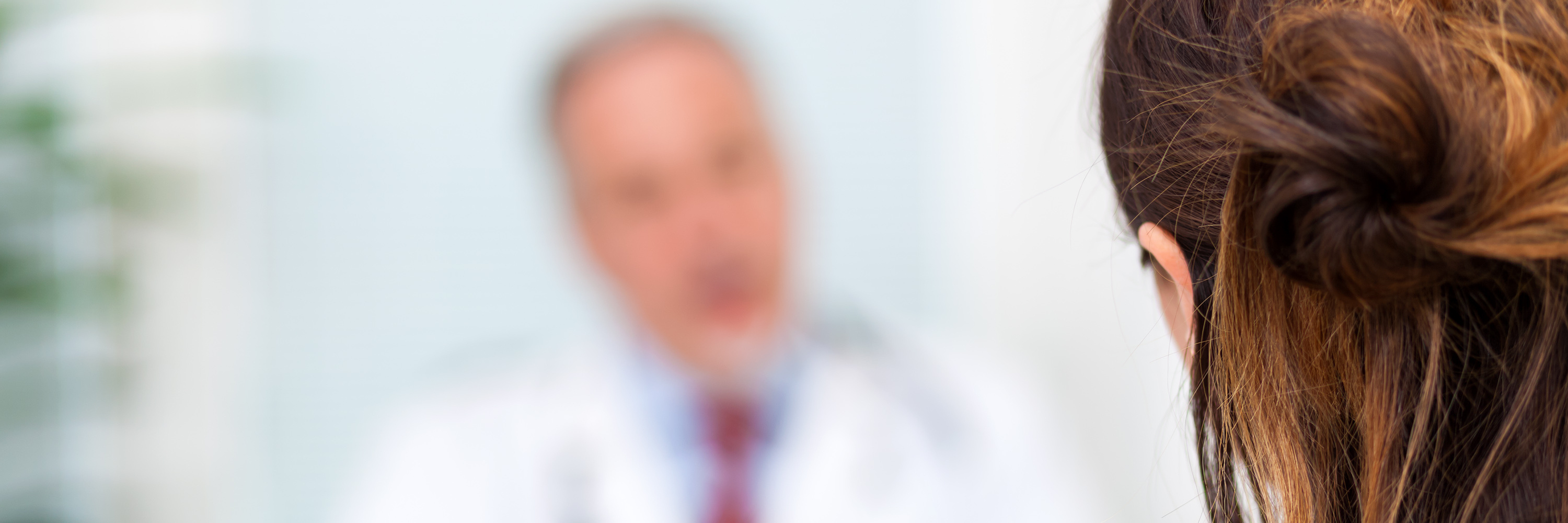 What Neurologists Should Know About Patients With Chronic Migraine female patient talking to a doctor