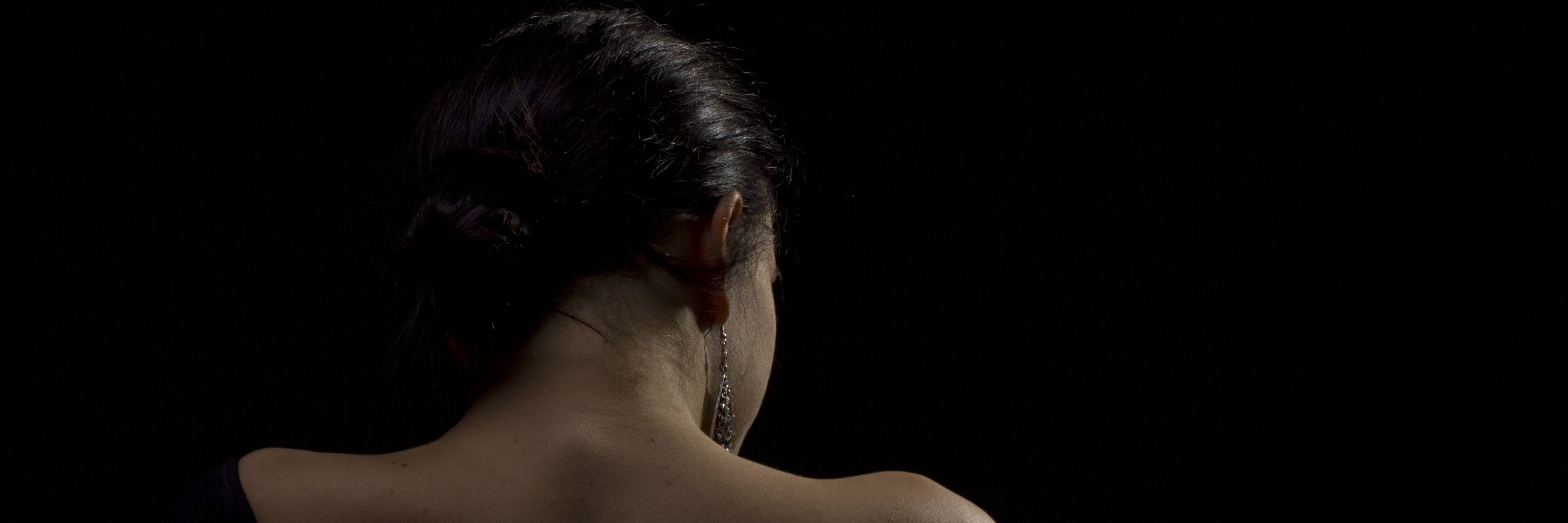 When 'Jokes' About My Chronic Illness Turned Into Emotional Abuse A woman with her back facing the camera.