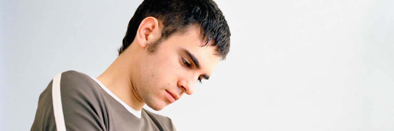 When Social Anxiety at Gatherings Makes You Seem Standoffish sad looking man