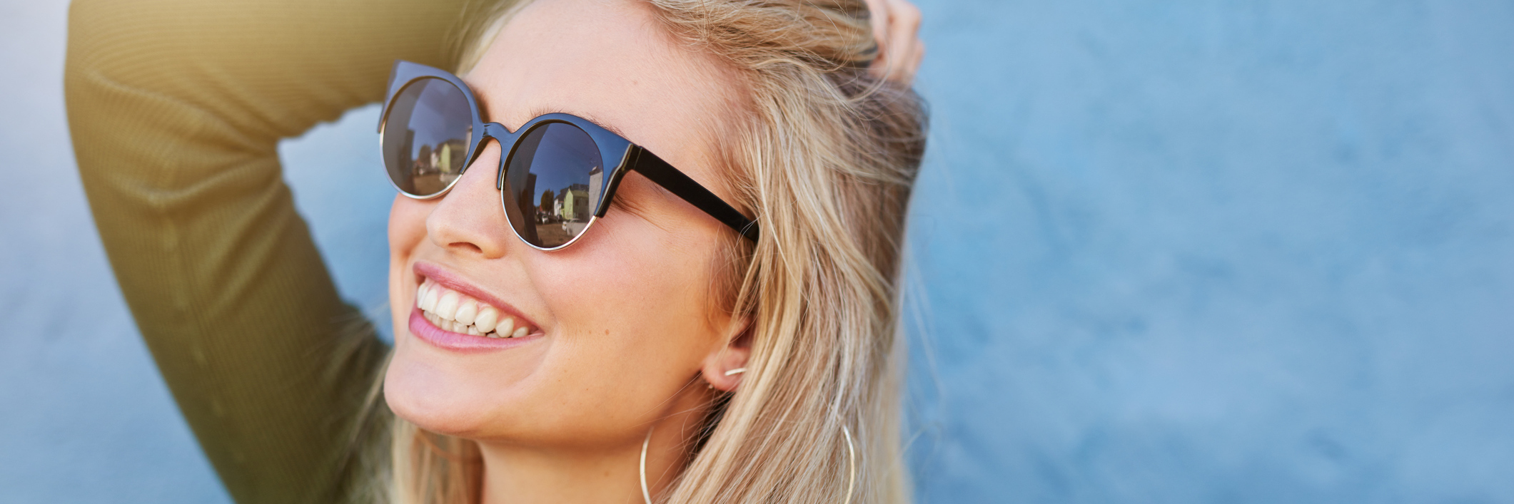 When I Became Ill, I Learned the Importance of Being 'Selfish' A woman wearing sunglasses, smiling.