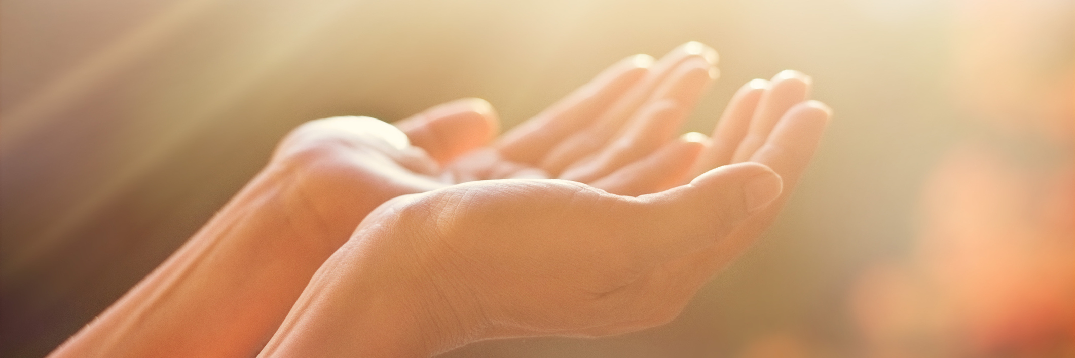 Having Hope for Healing After Getting Blood Test for Leaky Gut woman's hands extended under beams of light