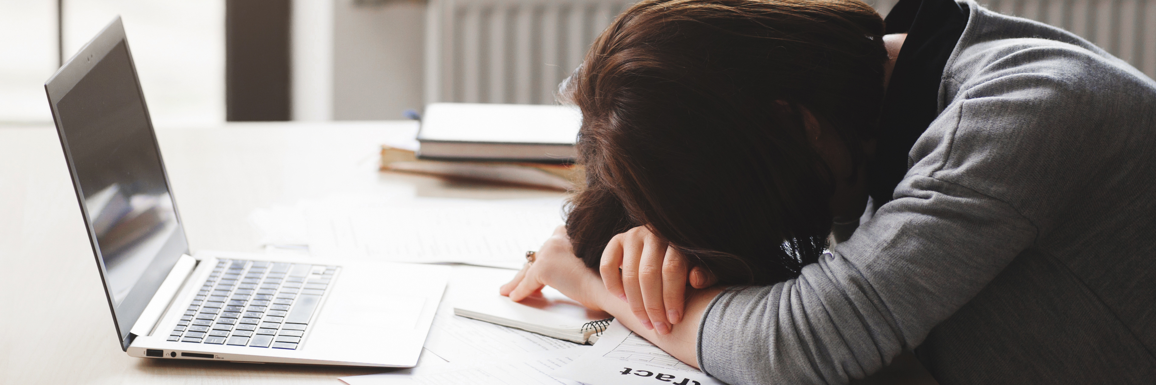 A Day in the Life of a Person With a Rare Sleep Disorder woman asleep at desk
