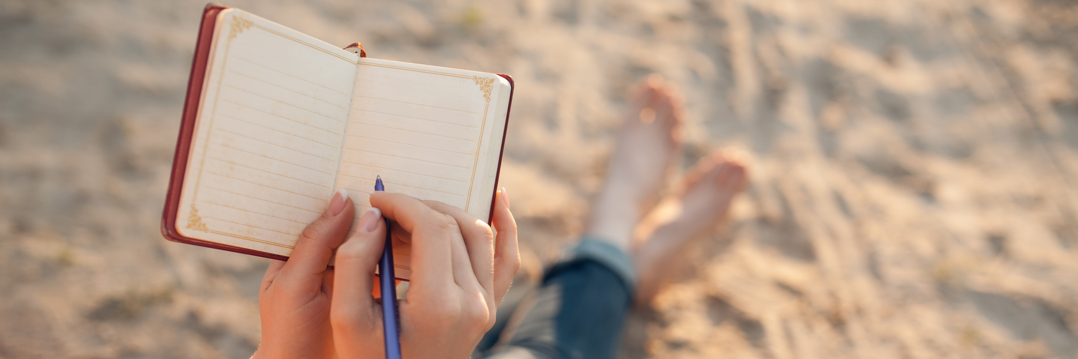A Poem Dedicated to Teachers Who Accept Me and My Disability Young woman sitting on the beach writing.
