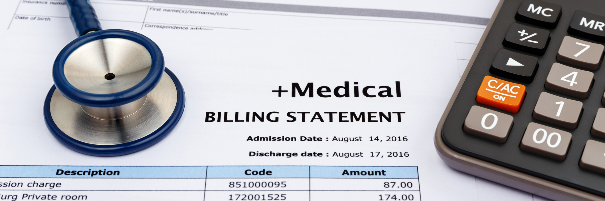 medical bill statement next to calculator and stethoscope