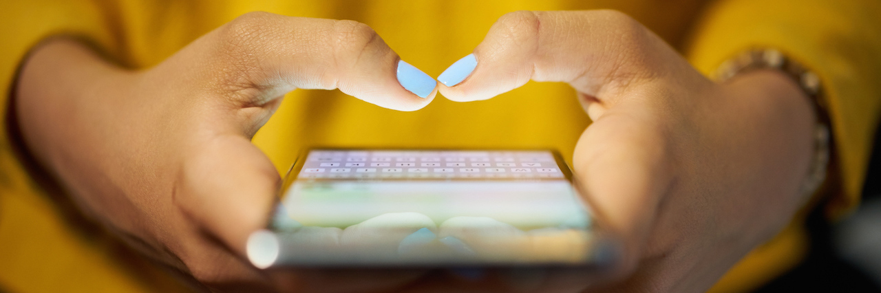 Useful Australian Mental Health Apps Woman on her phone
