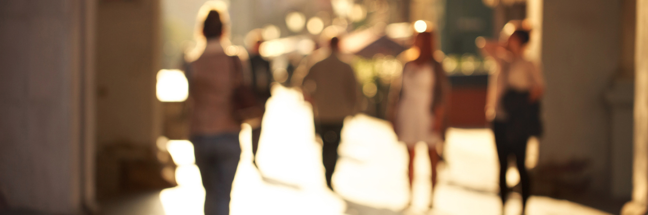 What Happened After My Depressive Episode Blurred background of unrecognizable persons rushing through the arch on the touristic street.