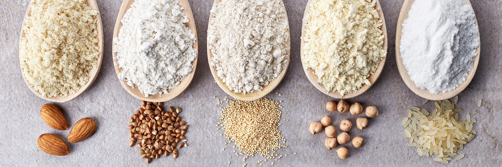 10 Things I Wish I Knew When I Was Diagnosed With Celiac Disease Wooden spoons of various gluten free flour (almond flour, amaranth seeds flour, buckwheat flour, rice flour, chick peas flour) from top view.