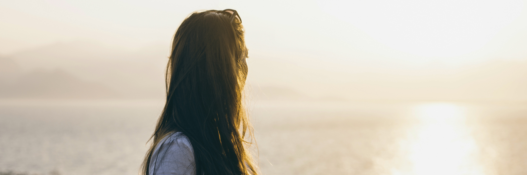 How Lyme Disease Has Affected My Cognitive Function Photo of a young woman look out into the ocean.
