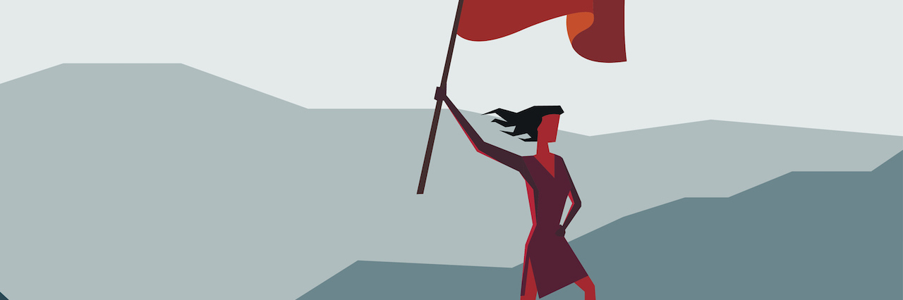 I Called Out a Professional for Stigmatizing Bipolar A woman with a flag on a mountain