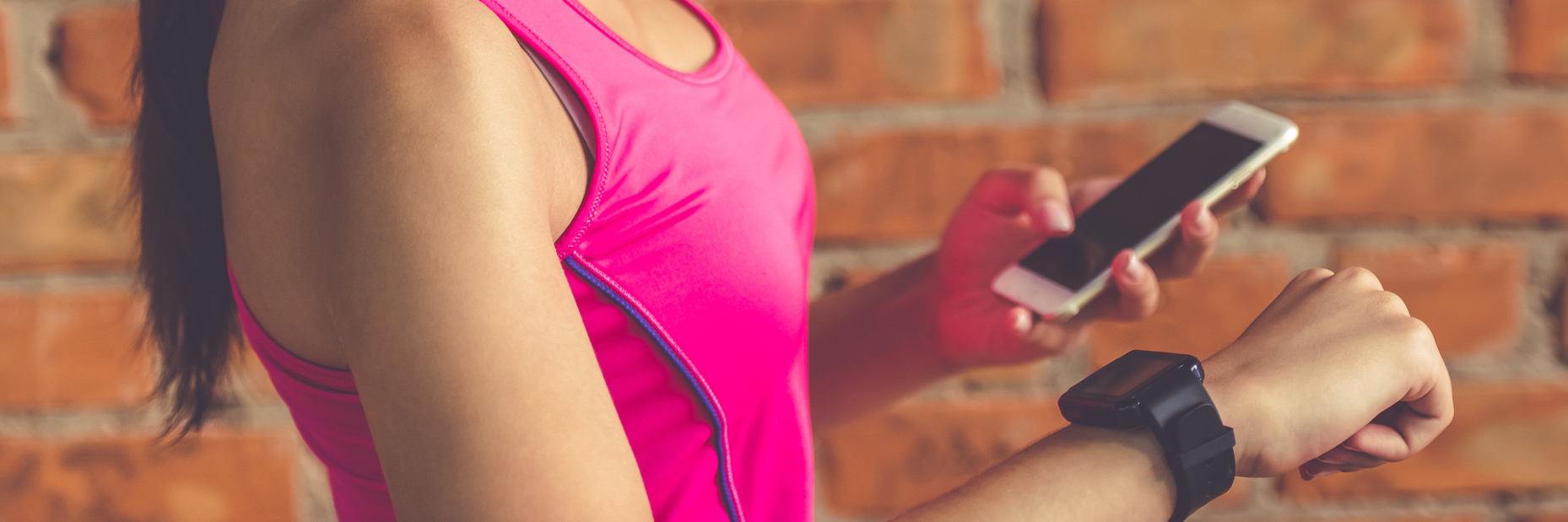 woman checking her fitness tracker watch