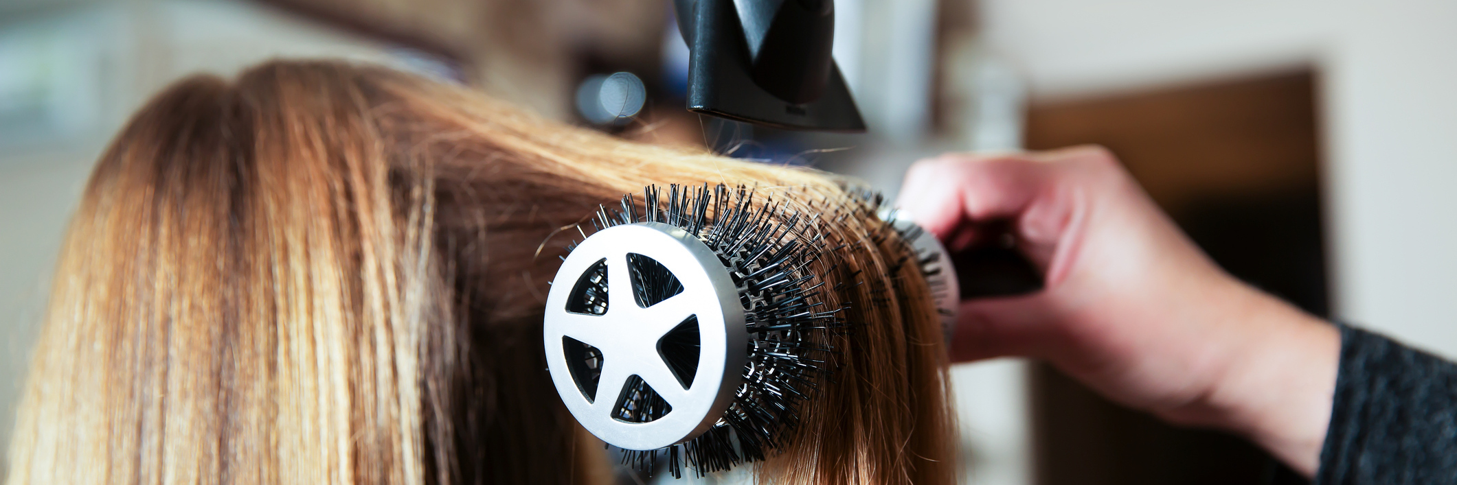 6 Activities People Might Not Realize Are Affected by Chronic Pain woman blow drying her hair