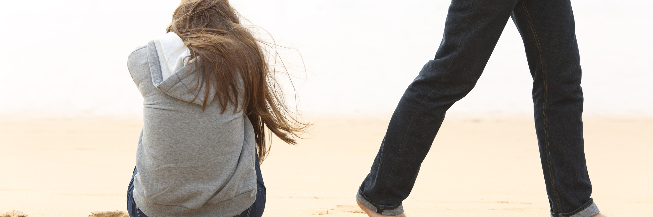 Inflammatory Arthritis: When People Leave After a Bad Pain Week guy walking away from girl sitting on the beach