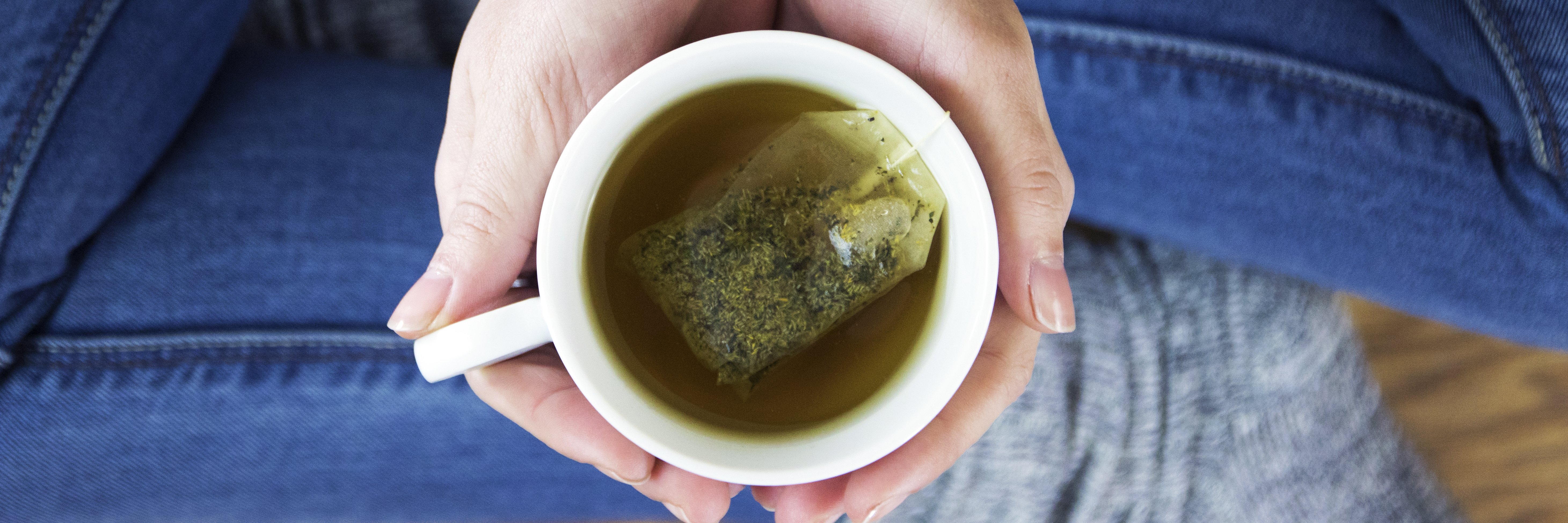 Realistic and Affordable Self-Care Tips to Improve Your Mental Health close up of woman's hands holding up of loose leaf tea