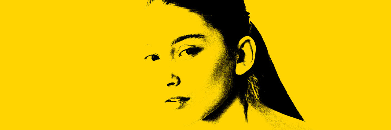 My Struggle With Loving My Body Unconditionally girl in front of bright background