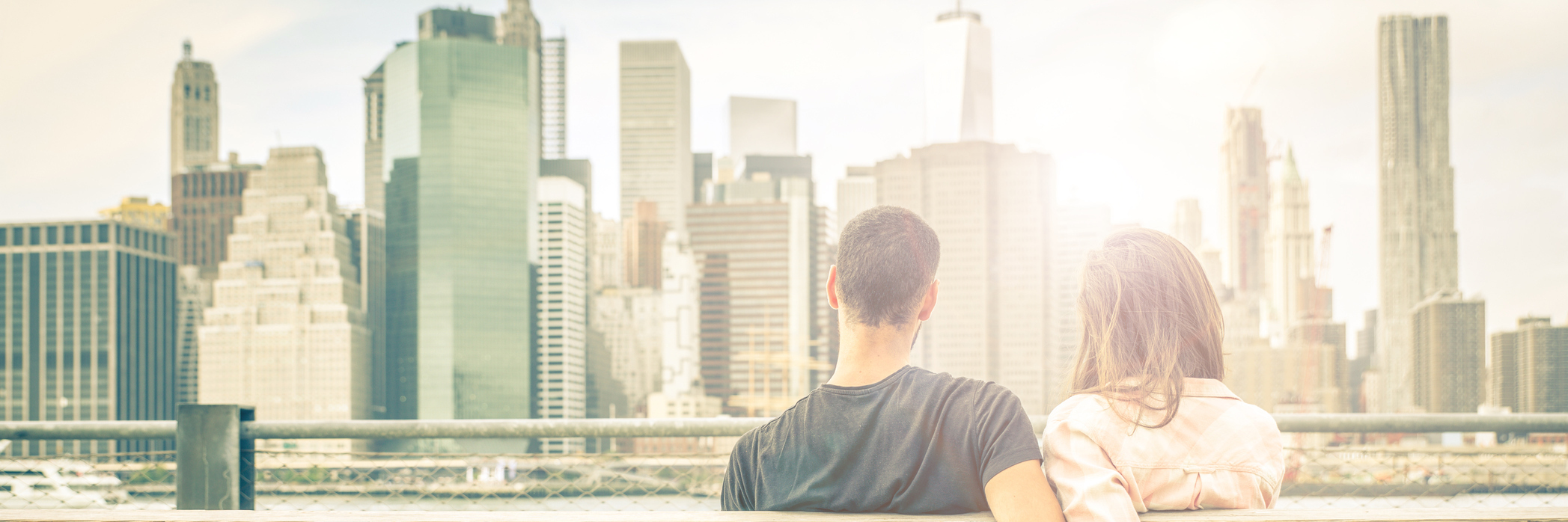 Things to Know about Loving Someone With Anxiety couple relaxing on New york bench in front of the skyline at sunset time. concept about love,relationship, and travel