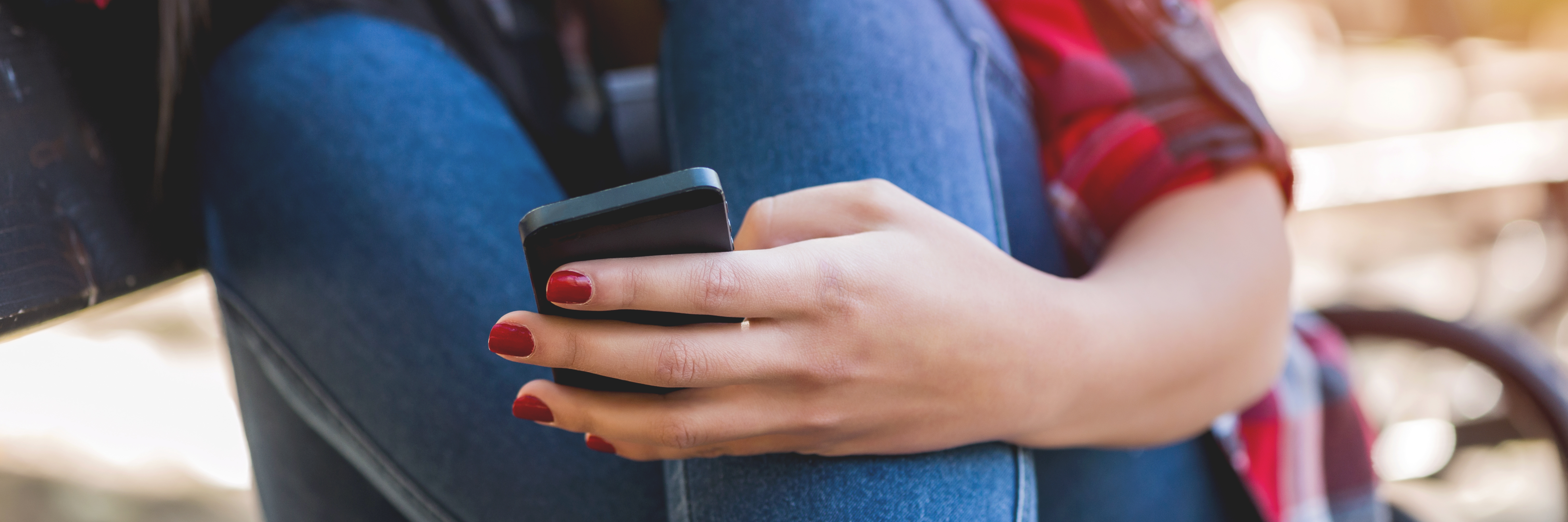 Maintaining Relationships With Anxiety and Depression sad woman in checkered shirt with cellphone