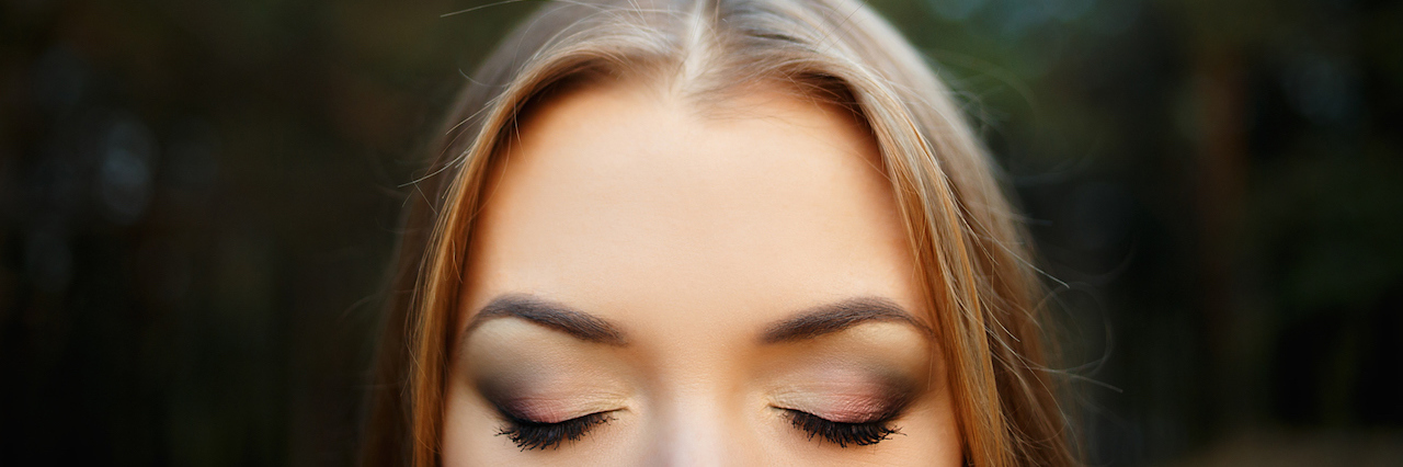 Reclaiming the Self-Worth My Depression Took From Me a girl closing her eyes