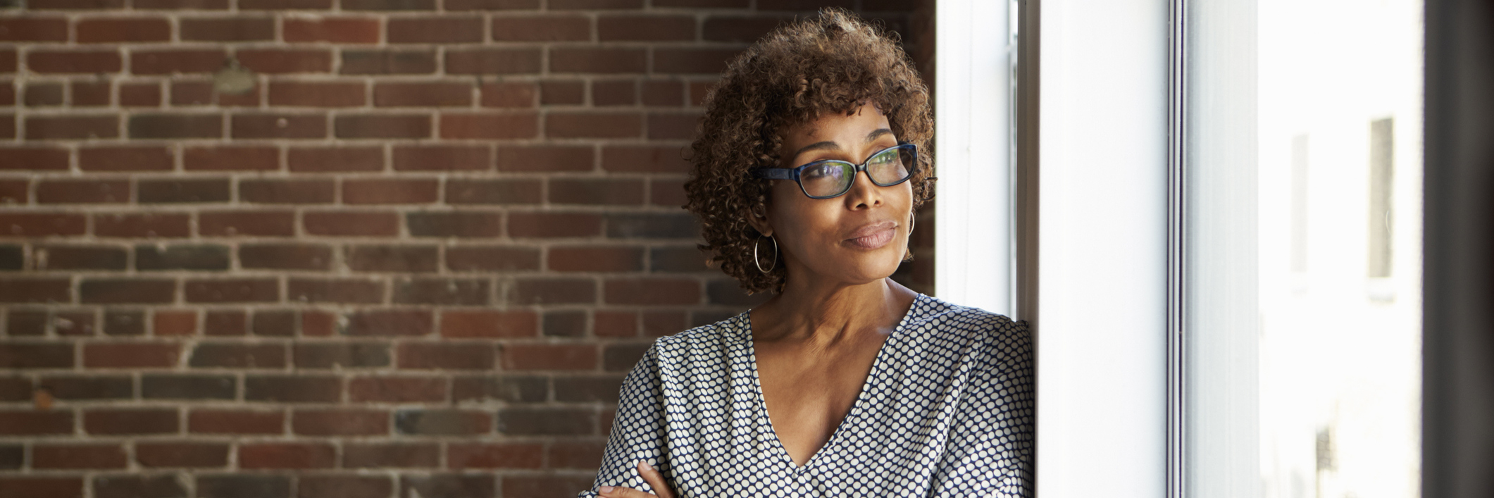 Holding Onto Hope After Primary Lateral Sclerosis Diagnosis woman leaning against a window looking outside