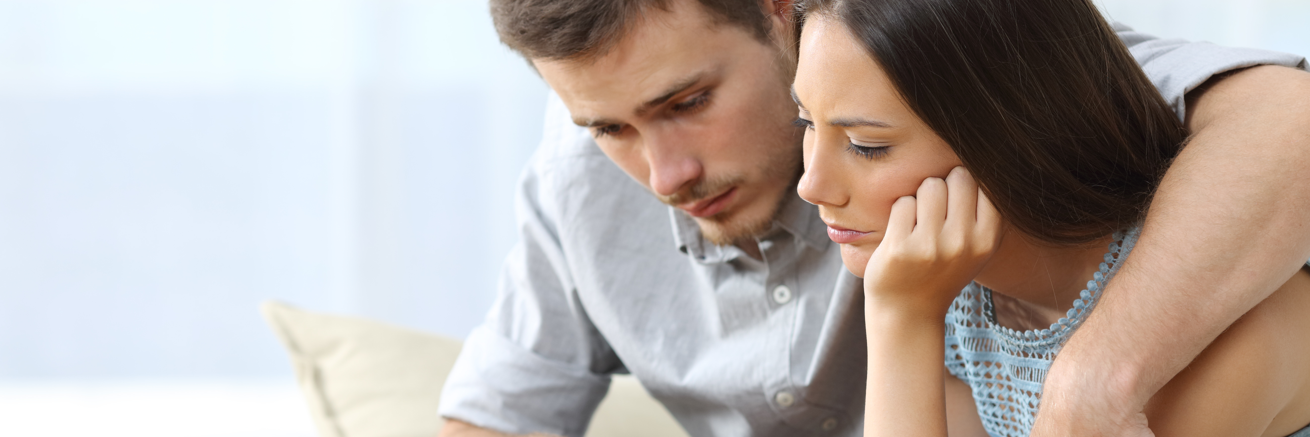 How to Help Someone When They Are Hearing Voices man comforting woman in house with arm around her