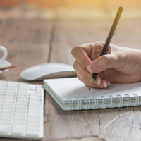 woman writing in a notebook