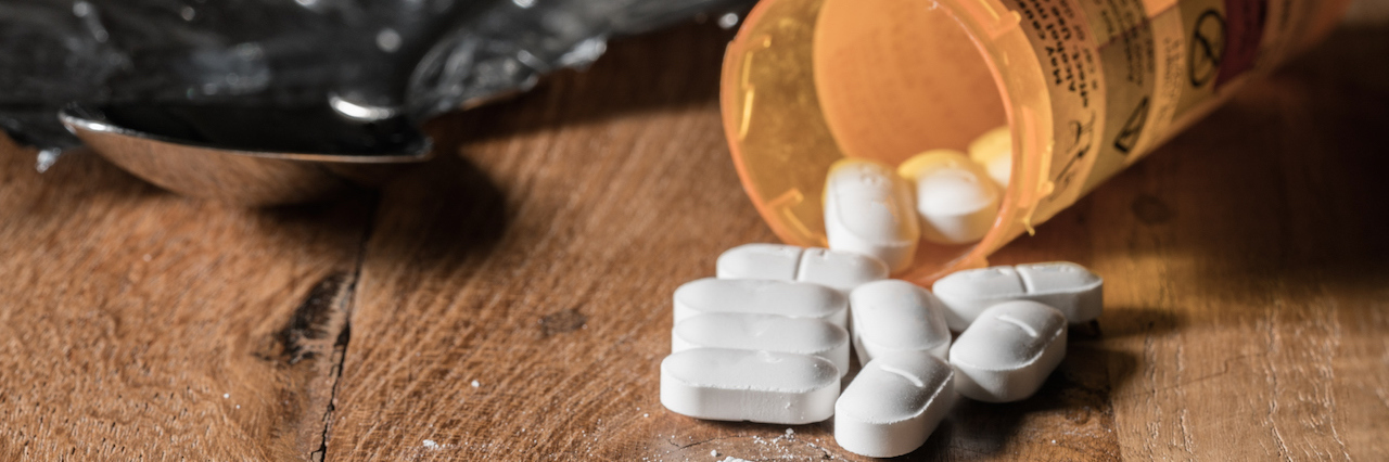 More Than Half of Opioid Prescription Go to People With Mood Disorders A bottle of pills spilling out on a table